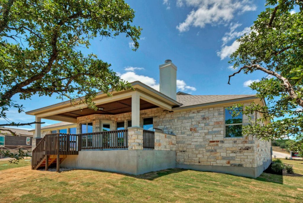 Custom single-story patio home with natural stonework 